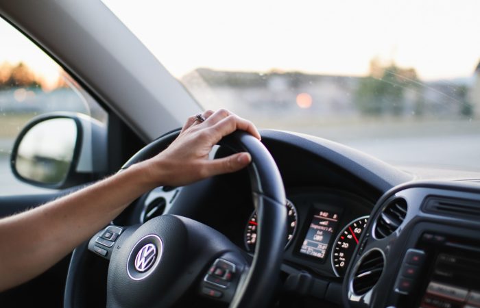 a-womans-hand-on-the-steering-wheel-of-her-car_t20_YVdKjm
